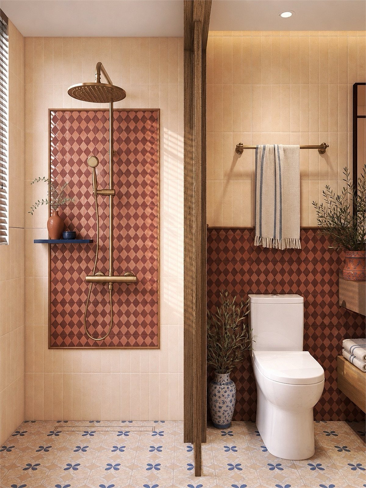 Bathroom with red diamond patterned wall tiles and blue floral patterned floor tiles.