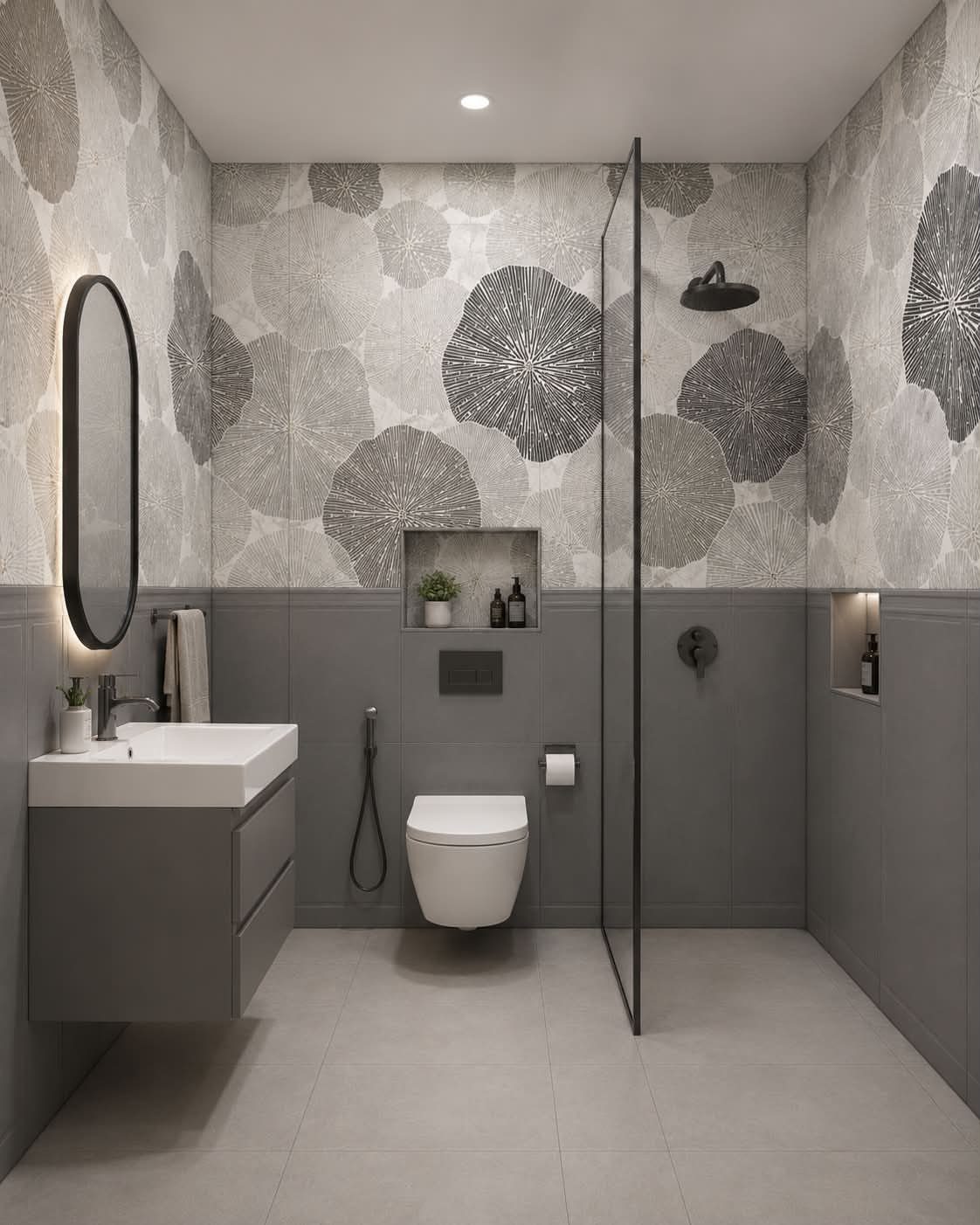 Modern bathroom with grey floral wall tiles and large format grey floor tiles.