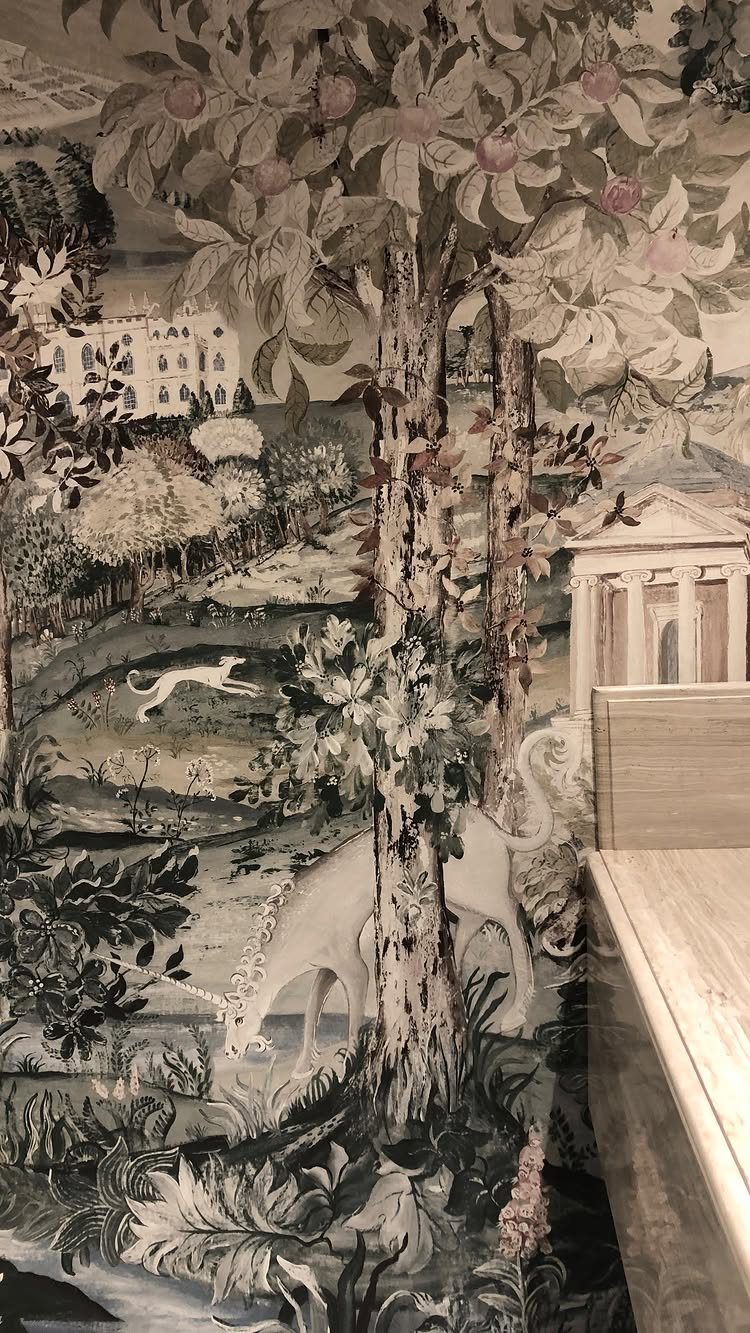 Landscape wallpaper with a unicorn and classical buildings next to a marble counter.