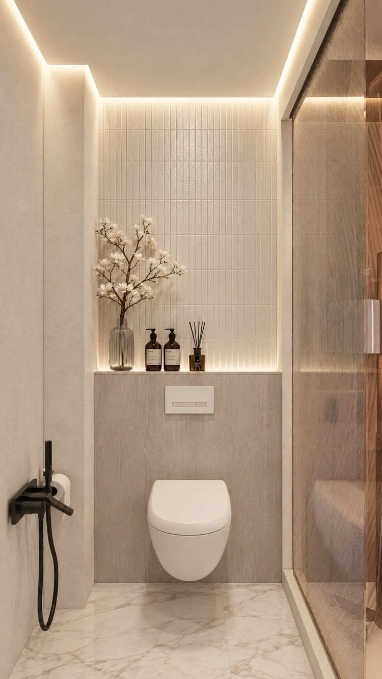 White wall-hung toilet in a modern bathroom with vertical white ceramic wall tiles.
