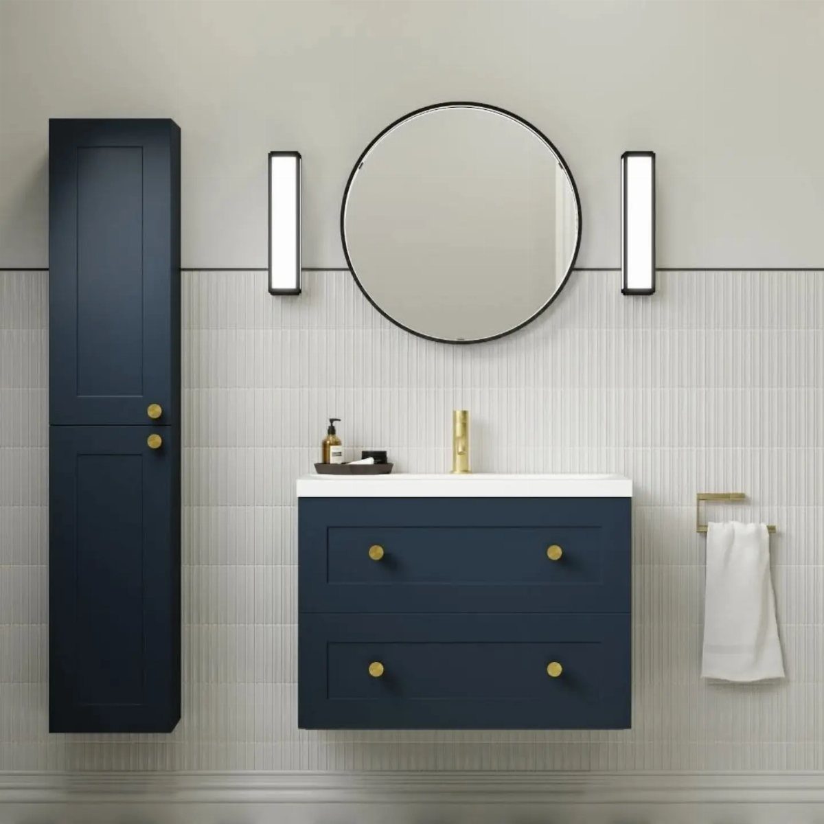 Navy blue bathroom vanity and cabinet against light grey walls with round mirror.