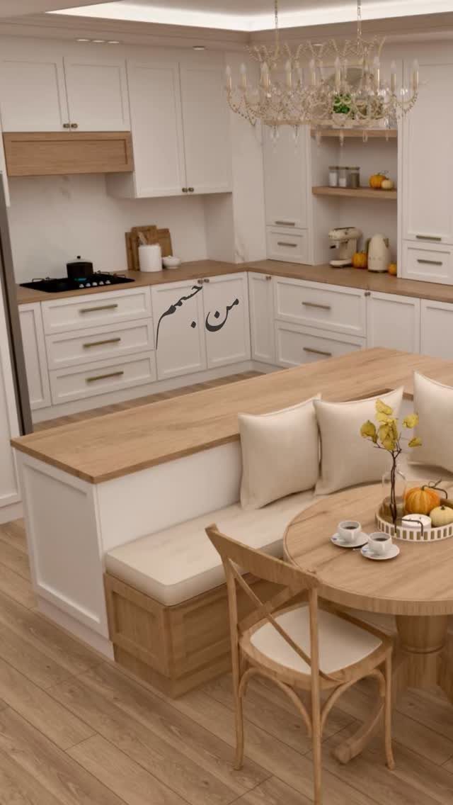 Built-in white banquette seating with beige cushions next to a round wooden table.