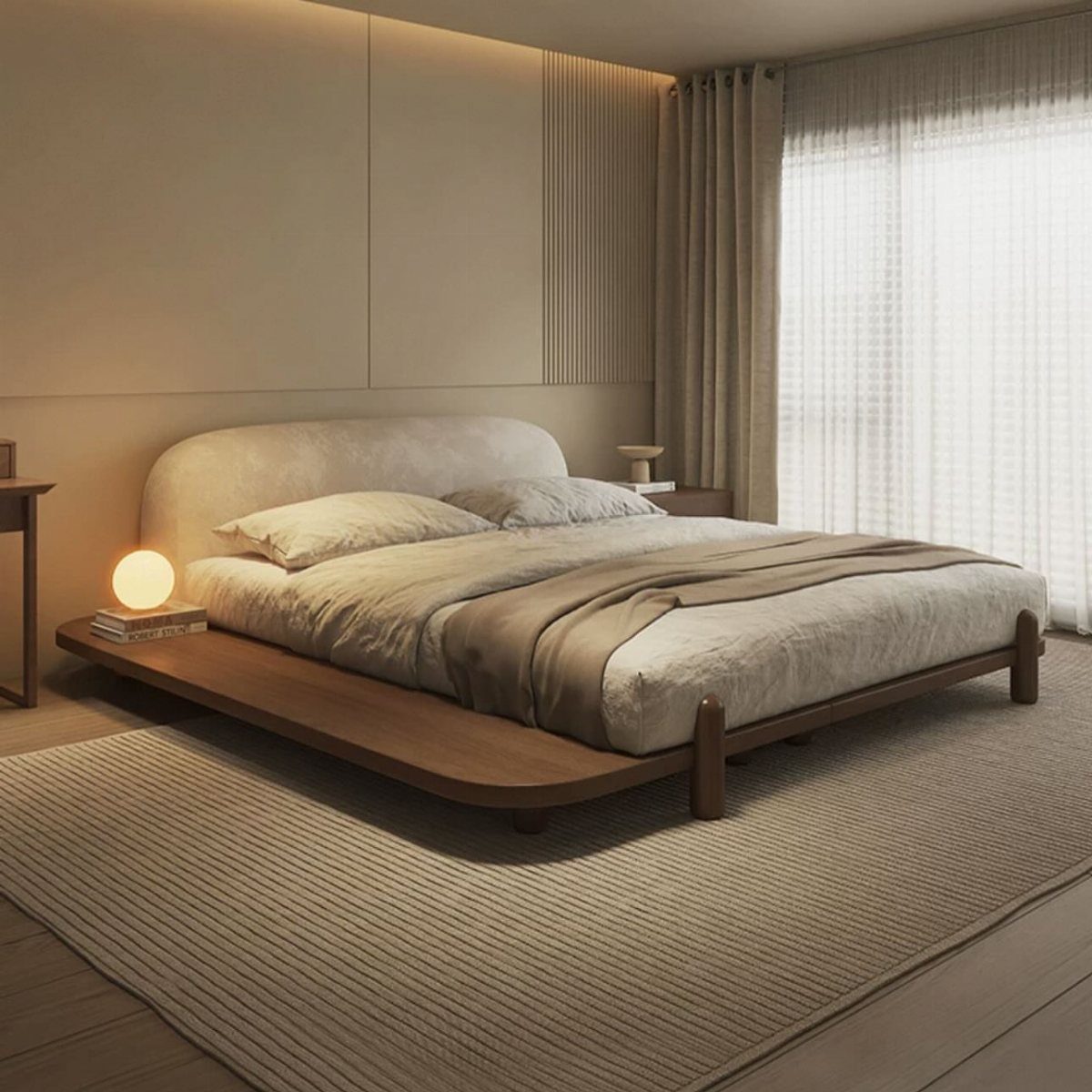 Low-profile wooden platform bed with beige linens in a minimalist neutral bedroom