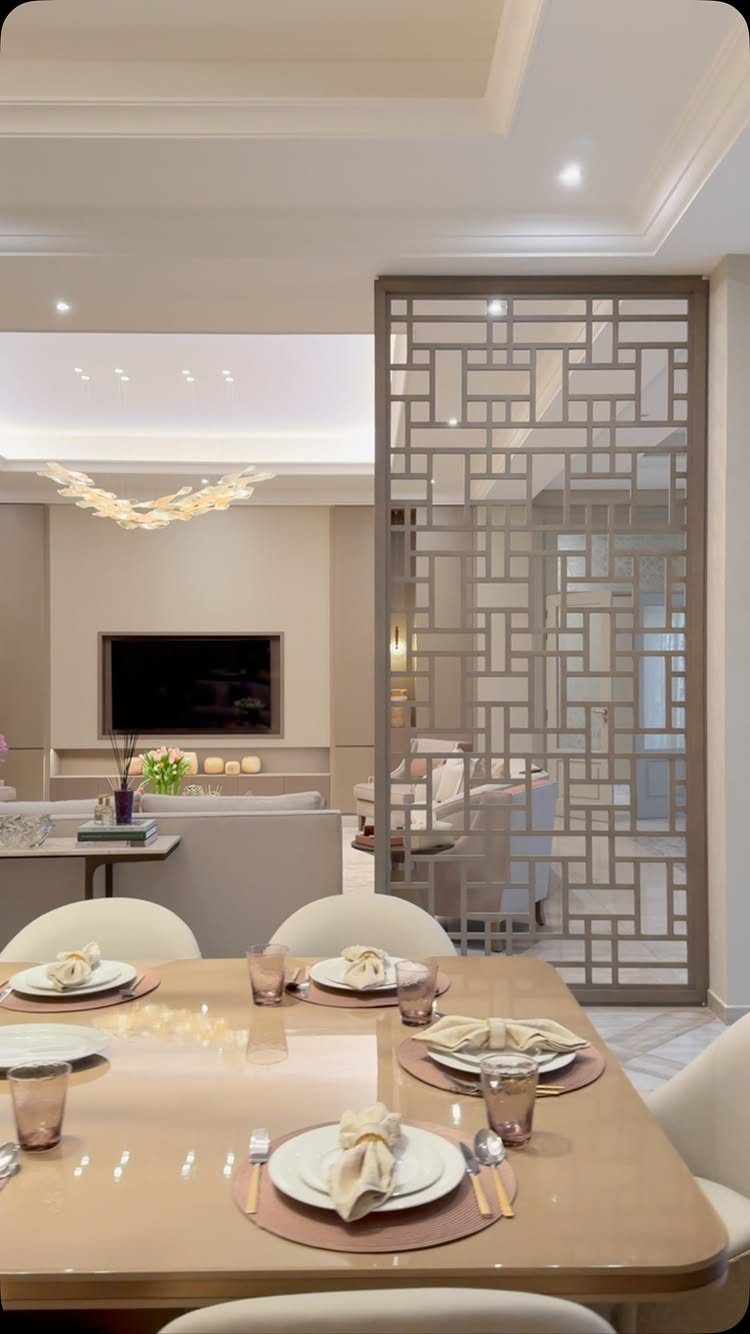 Modern open concept studio apartment with dining area and living room separated by screen