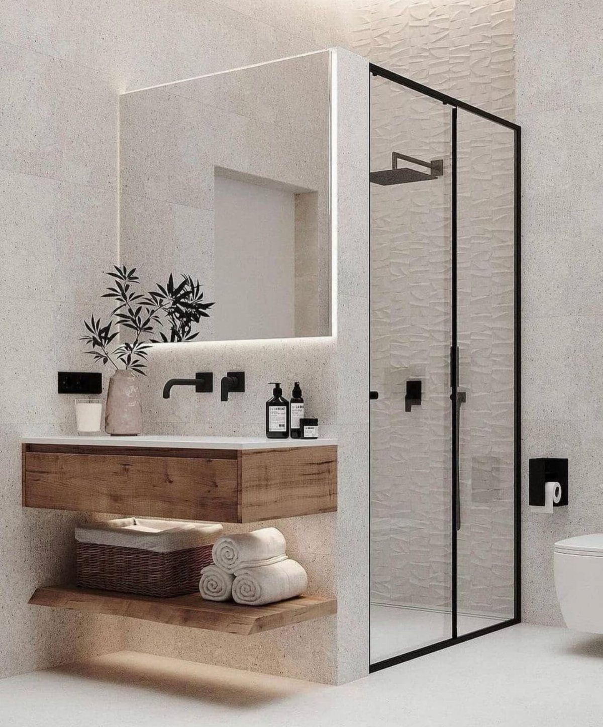 Modern bathroom featuring a floating wooden vanity and black framed glass shower doors.