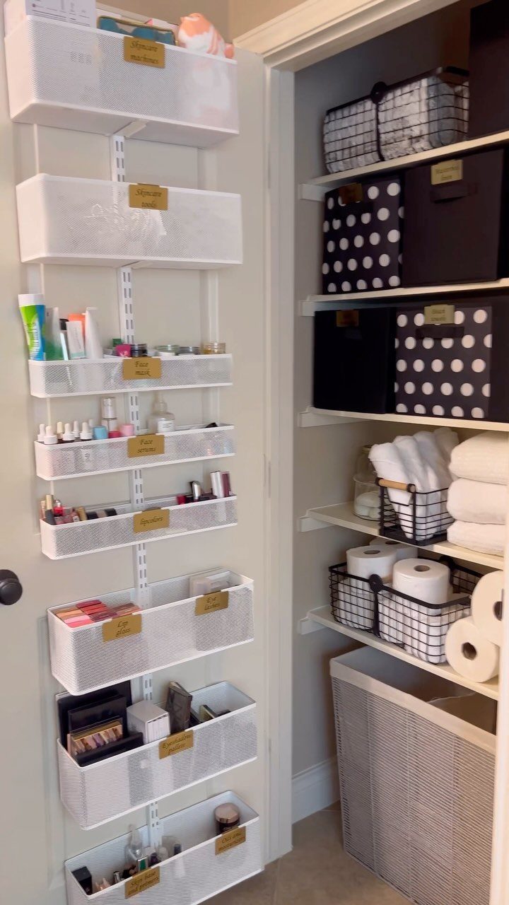 White over-the-door organizer filled with beauty products and toiletries next to a closet.