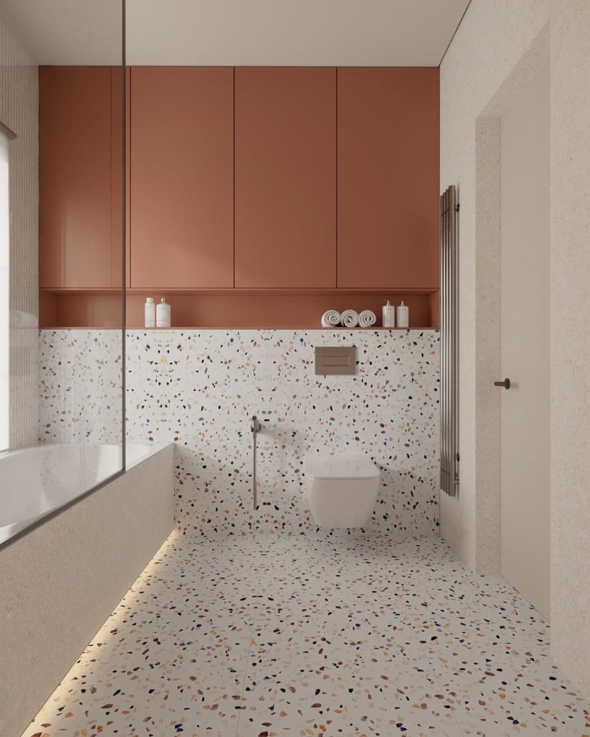 White terrazzo tiles on the floor and walls of a modern bathroom.