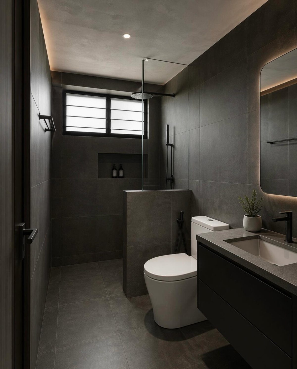 Modern dark grey bathroom with a small window providing natural light above the shower.