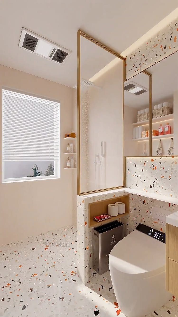 Modern small bathroom with terrazzo flooring and a glass walk-in shower enclosure.