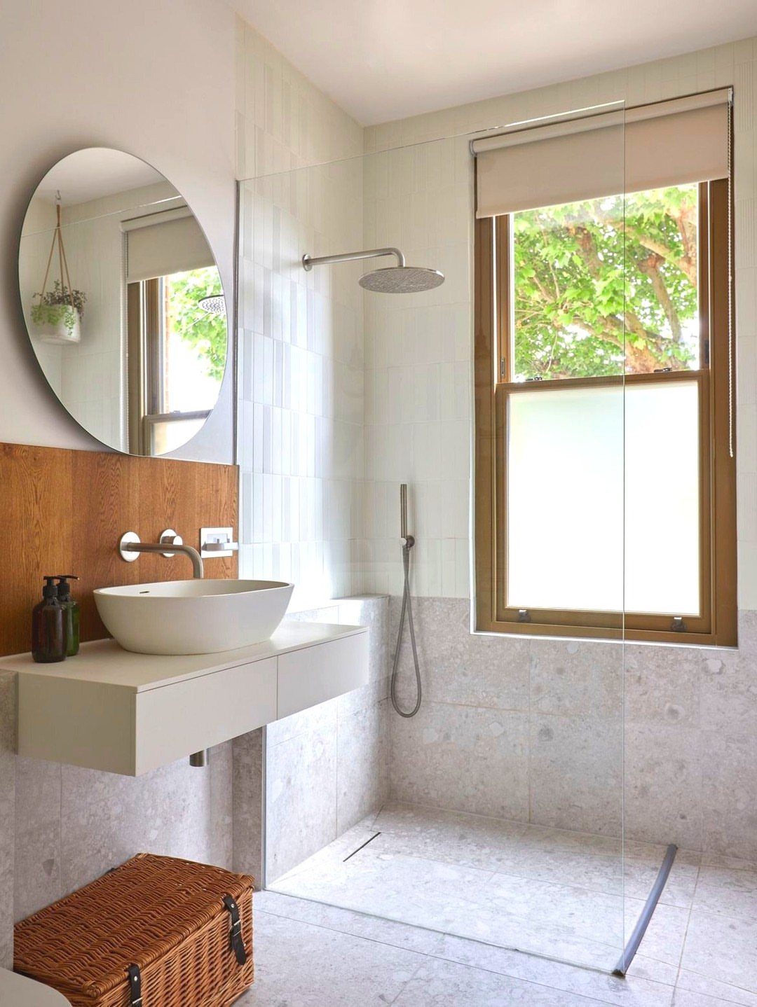 Modern bathroom with a wooden-framed window featuring a frosted lower glass pane.