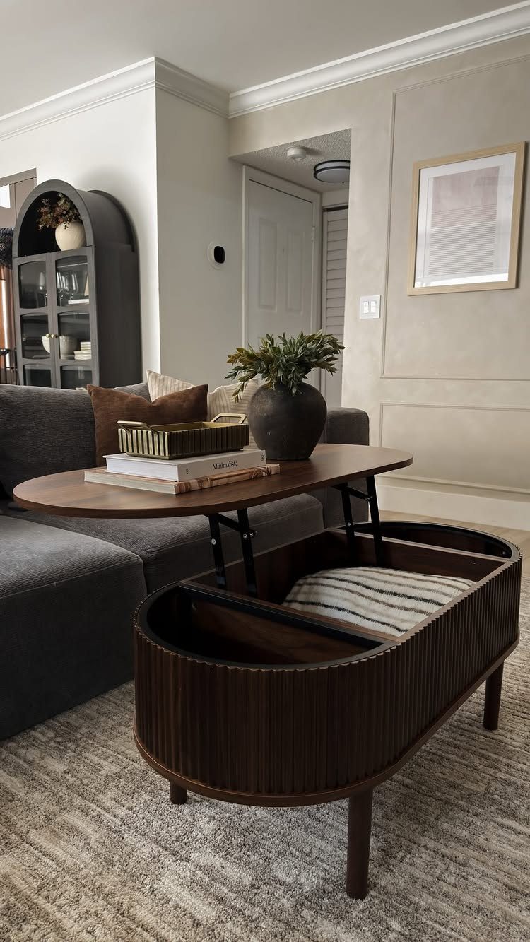 Dark wood lift-top coffee table with storage in a neutral living room setting