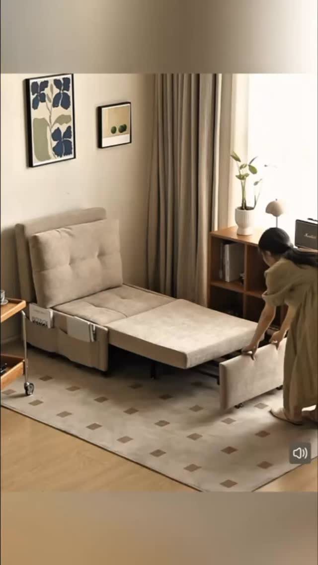 Woman adjusting a beige convertible sofa bed in a neutral modern living room