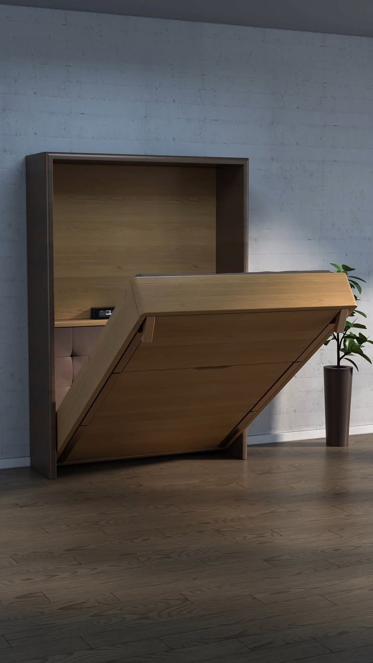 Wooden Murphy bed partially unfolded from a grey cabinet against a concrete wall.