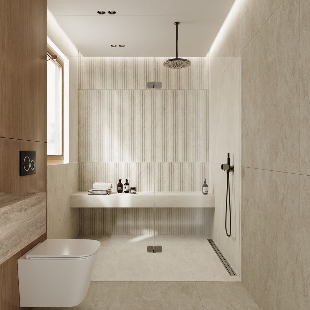 Modern walk-in shower with vertical ribbed textured tiles and a rain showerhead.